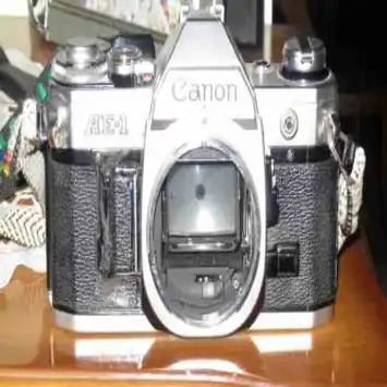 دوربین عکاسی CANON AE1بالنزنرمال50